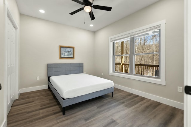 bedroom featuring baseboards, dark wood-style flooring, and recessed lighting