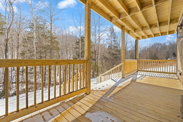 view of snow covered deck