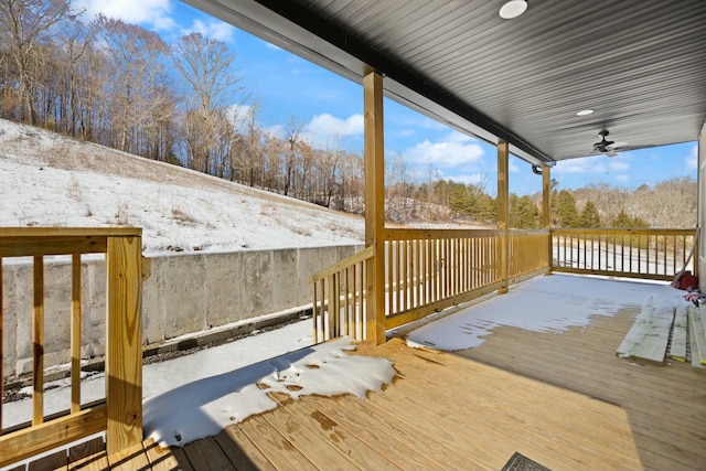 snow covered deck with a ceiling fan