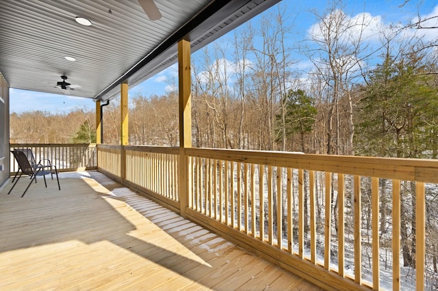 wooden terrace featuring ceiling fan