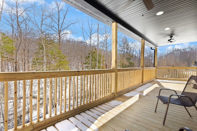 wooden terrace with a ceiling fan