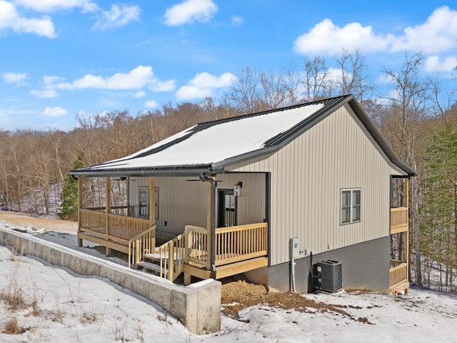 view of front of property with covered porch, central AC unit, and a ceiling fan