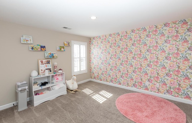 game room with carpet floors, visible vents, and baseboards