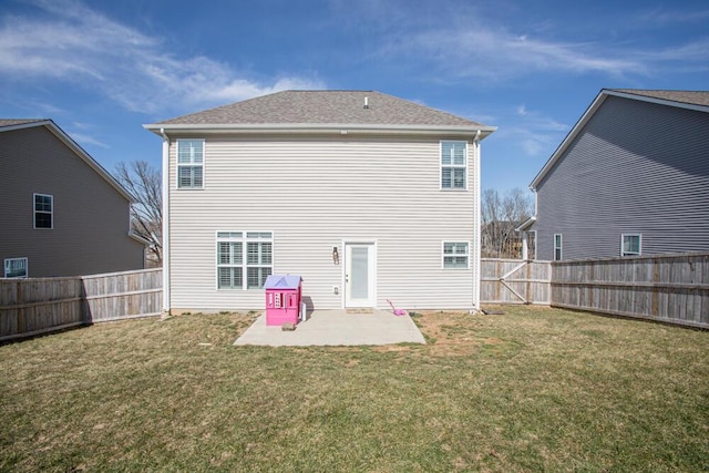 back of house with a yard, a patio area, and a fenced backyard