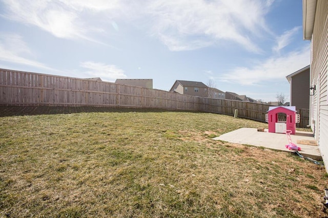 view of yard with a patio area and a fenced backyard