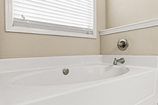 bathroom featuring a garden tub