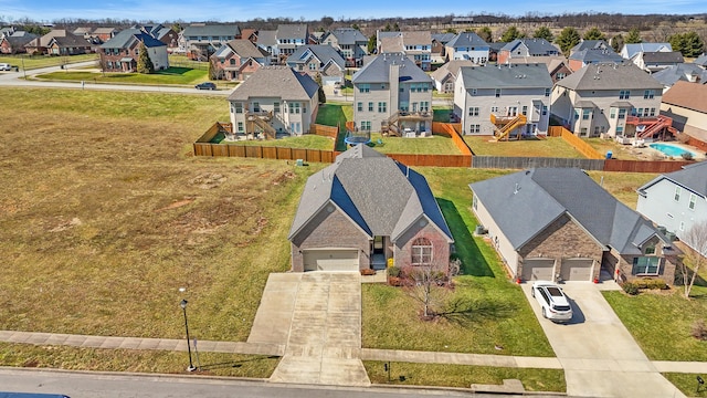 birds eye view of property with a residential view