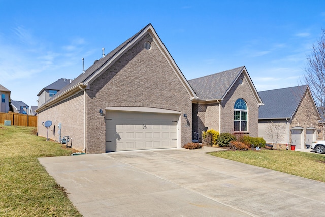 single story home with an attached garage, driveway, brick siding, and a front yard