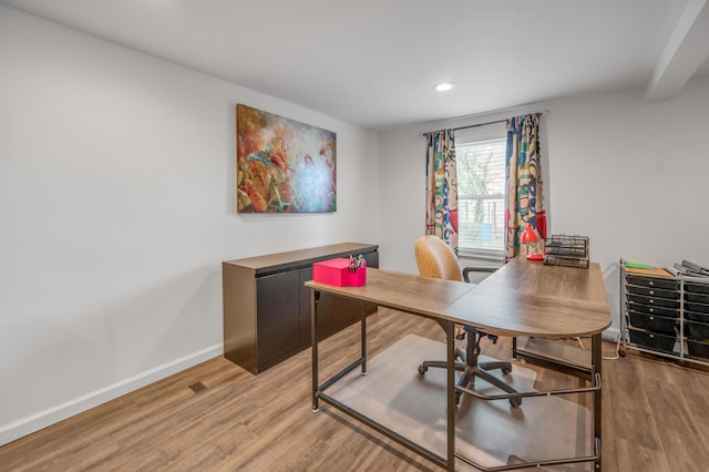 office space featuring recessed lighting, wood finished floors, and baseboards