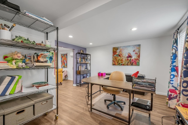 office area with baseboards, light wood finished floors, and recessed lighting