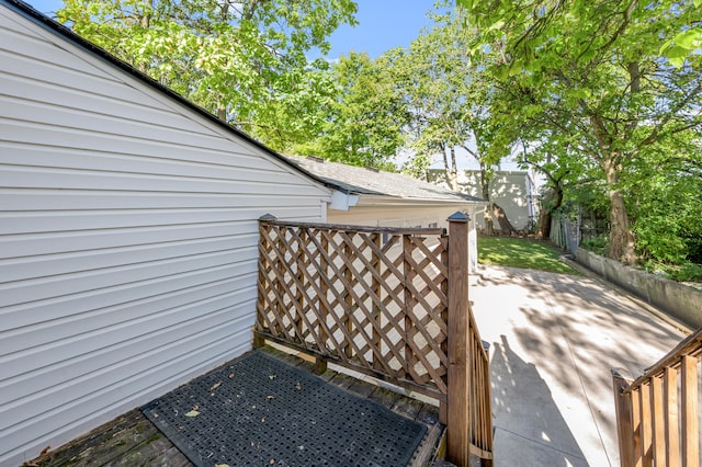 deck with a patio area and fence