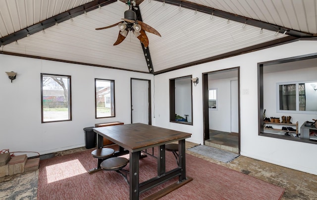 office with stone finish flooring and vaulted ceiling