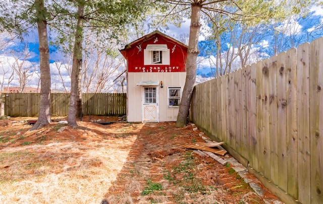 view of shed featuring a fenced backyard