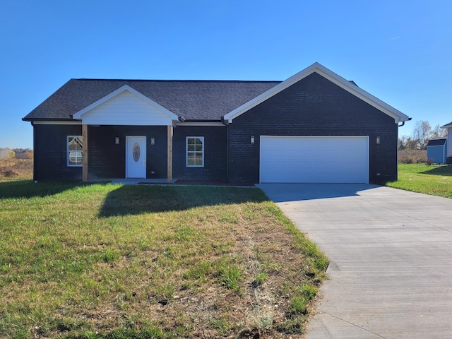 single story home with concrete driveway, a front lawn, and brick siding