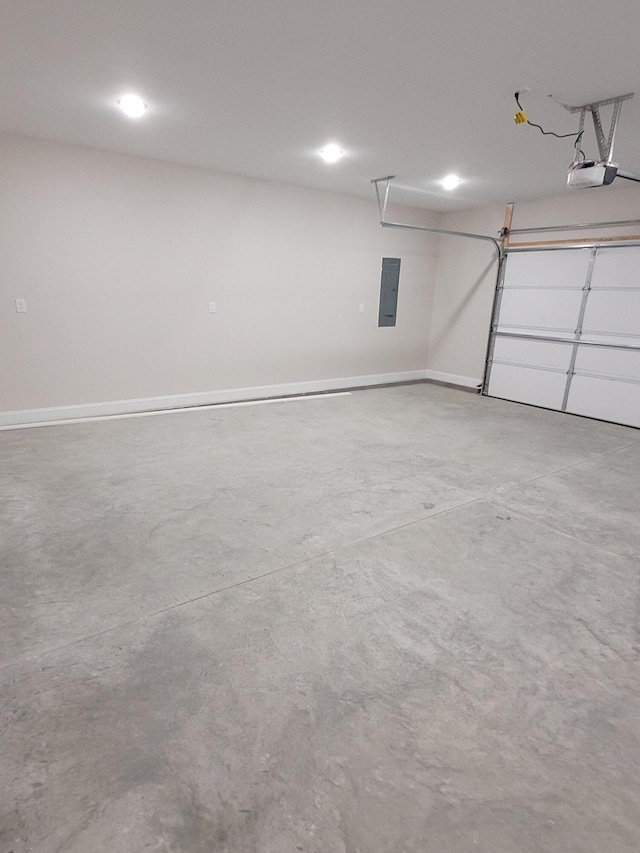 garage with electric panel, baseboards, and a garage door opener