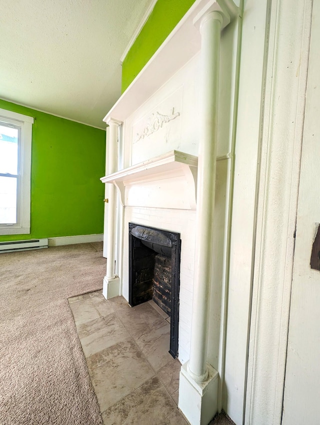 unfurnished living room featuring carpet flooring, a fireplace, a textured ceiling, and ornate columns