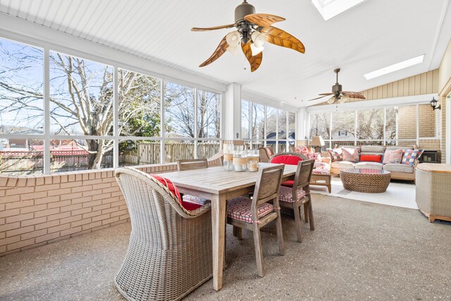 sunroom / solarium with an outdoor hangout area, a skylight, a ceiling fan, and outdoor dining space