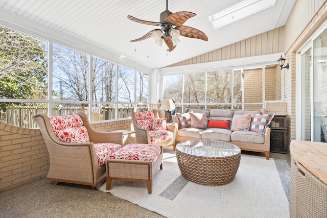 sunroom / solarium with an outdoor hangout area, vaulted ceiling, ceiling fan, and a skylight