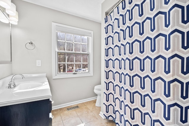 bathroom with toilet, vanity, tile patterned floors, baseboards, and a shower with curtain