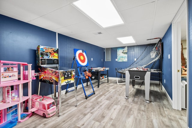 playroom with a drop ceiling, wood finished floors, and baseboards