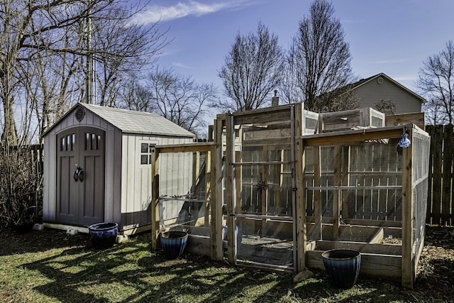 view of shed with fence