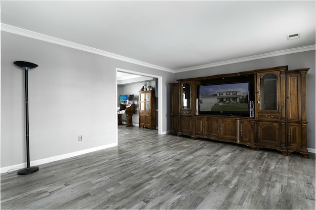 unfurnished living room with ornamental molding, wood finished floors, and visible vents