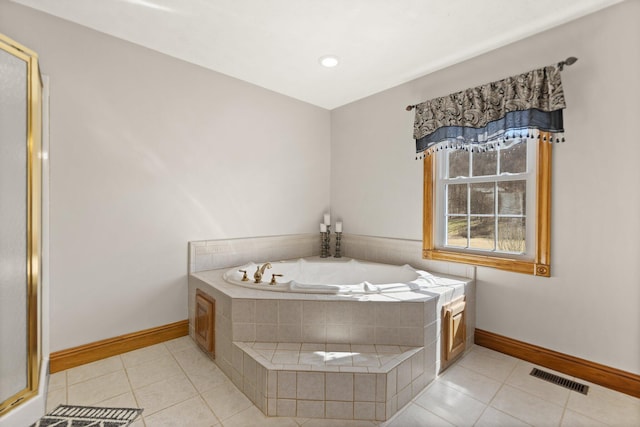 bathroom with a bath, a stall shower, tile patterned flooring, and visible vents