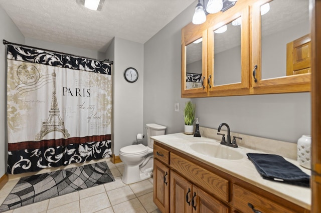 full bathroom featuring a textured ceiling, toilet, a shower with shower curtain, vanity, and tile patterned floors