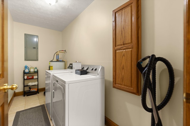 laundry area with cabinet space, light tile patterned floors, electric panel, washer and clothes dryer, and water heater