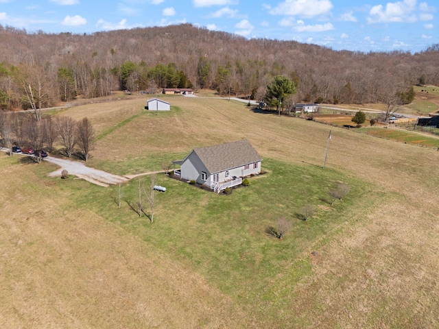 bird's eye view featuring a forest view and a rural view