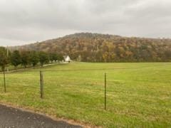 property view of mountains featuring a rural view