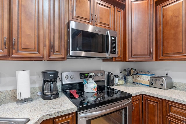109 Acorn Path, Georgetown, KY 40324 - kitchen featuring appliances with stainless steel finishes and brown cabinetry