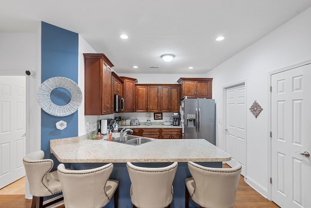 109 Acorn Path, Georgetown, KY 40324 - kitchen with stainless steel appliances, light countertops, a peninsula, a breakfast bar area, and recessed lighting