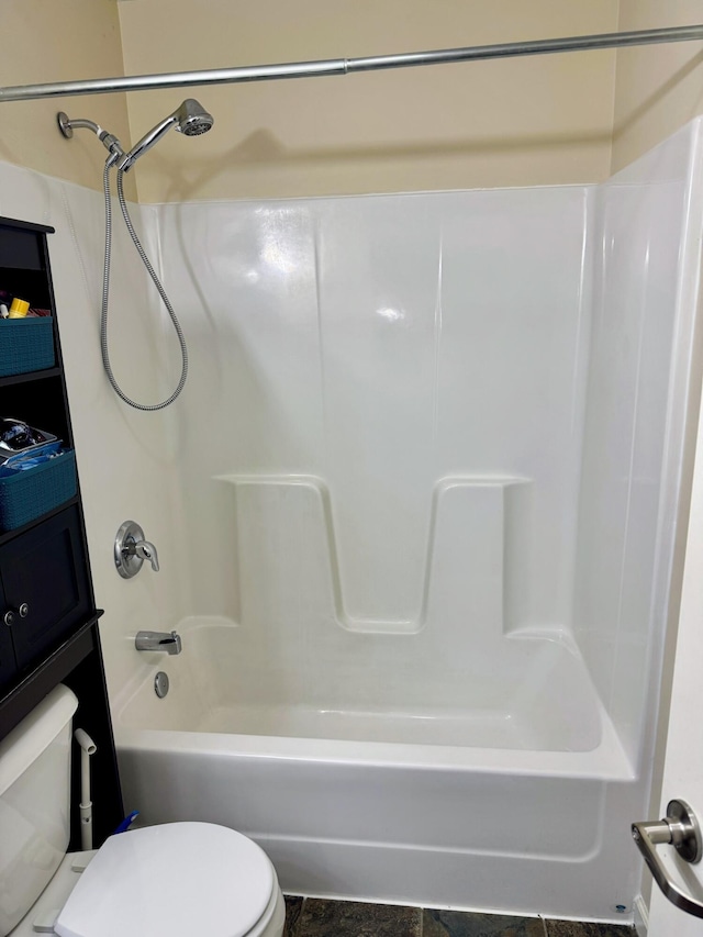 bathroom with shower / bathtub combination and toilet