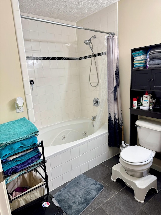 full bath featuring toilet, tiled shower / bath, a textured ceiling, and tile patterned floors