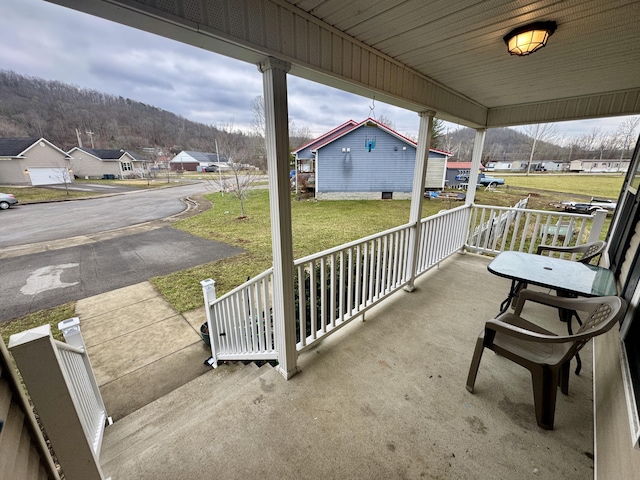 view of patio / terrace featuring covered porch and a residential view