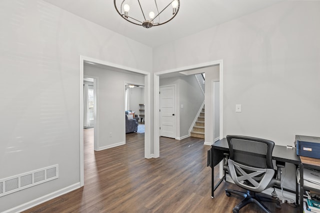 office area featuring dark wood-style floors, visible vents, a notable chandelier, and baseboards