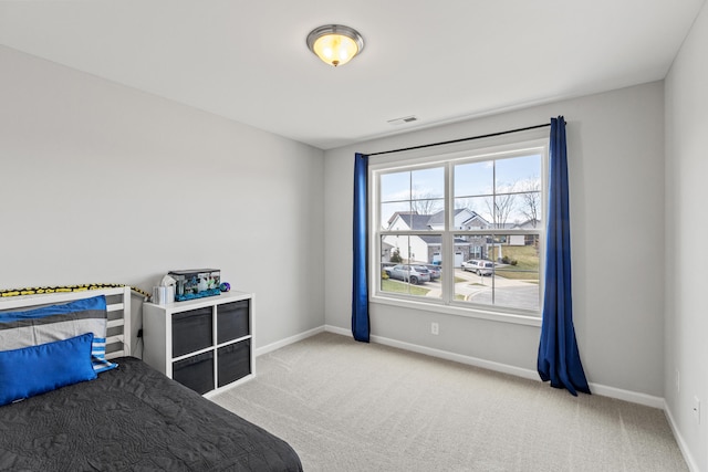 bedroom featuring carpet, visible vents, and baseboards