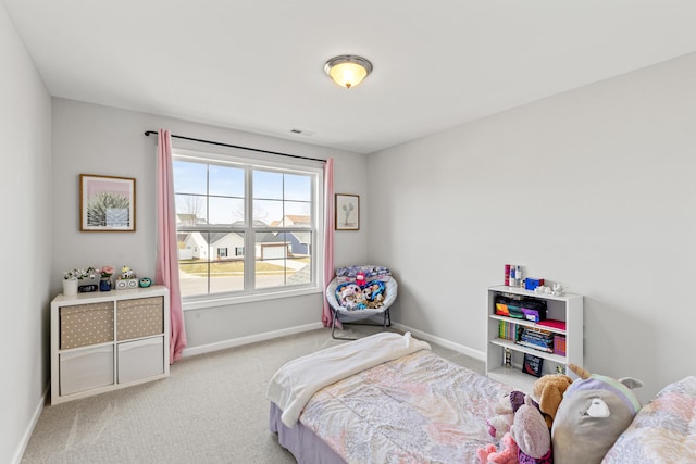 bedroom with carpet floors, visible vents, and baseboards