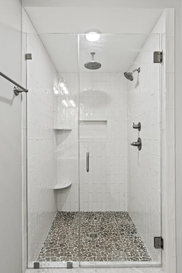 bathroom featuring a shower stall