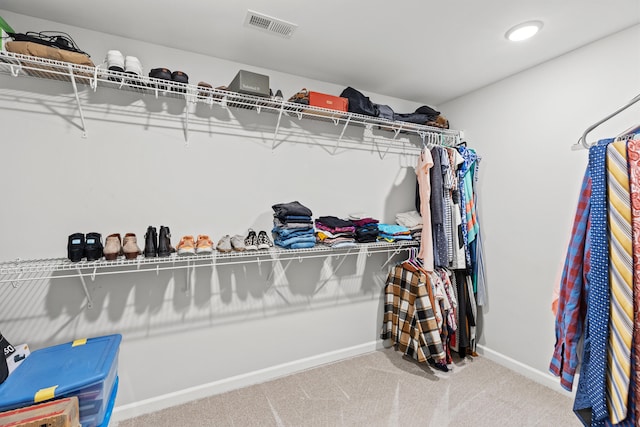 spacious closet featuring carpet flooring and visible vents