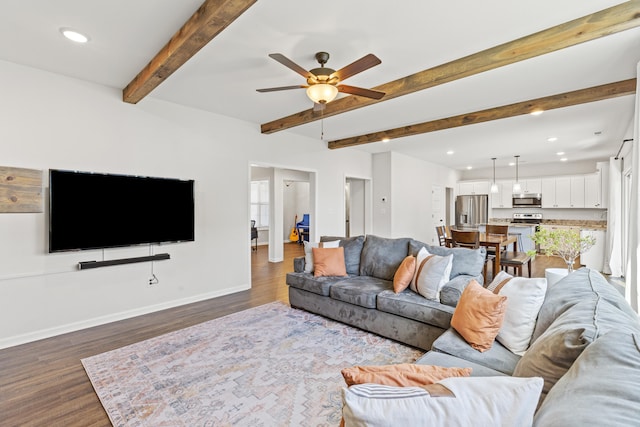 living room featuring dark wood-style floors, recessed lighting, beamed ceiling, and baseboards