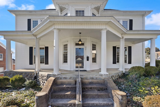 property entrance with covered porch