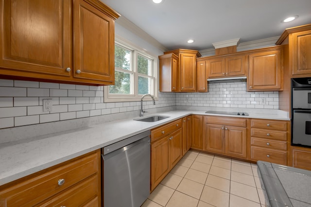 kitchen featuring light tile patterned floors, decorative backsplash, appliances with stainless steel finishes, crown molding, and a sink