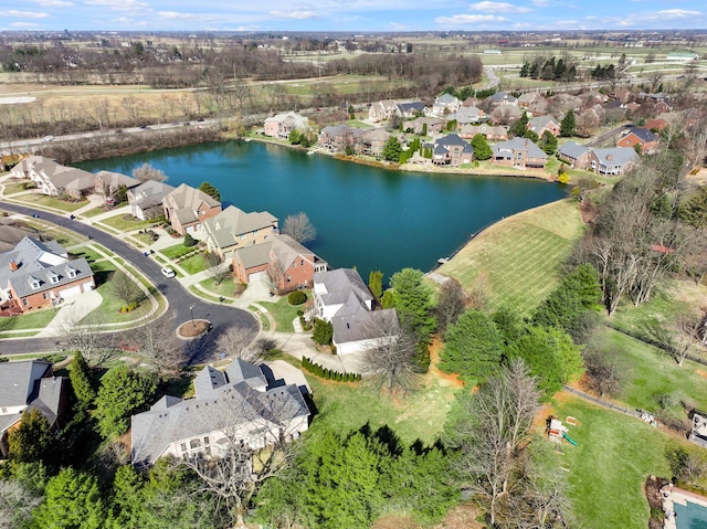 bird's eye view featuring a water view and a residential view