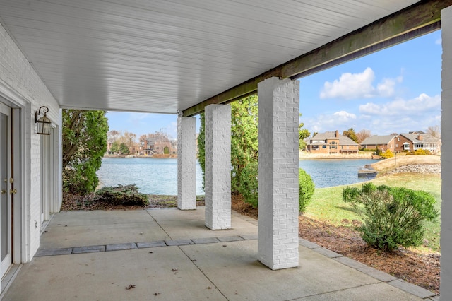 view of patio featuring a water view