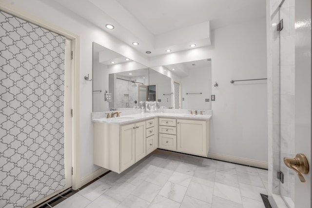 full bathroom with double vanity, recessed lighting, a sink, and a shower stall