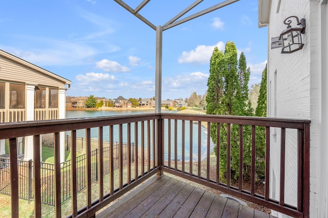 wooden deck featuring a water view