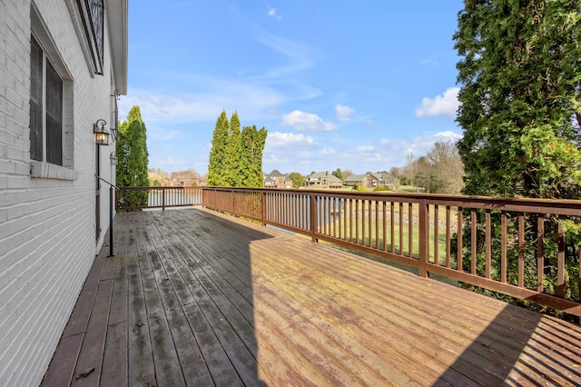 wooden terrace featuring a residential view