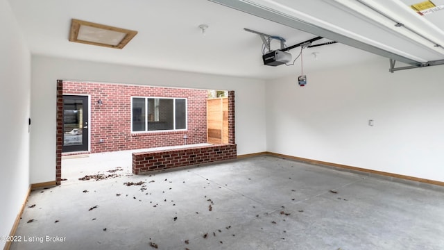 interior space featuring baseboards and a garage door opener